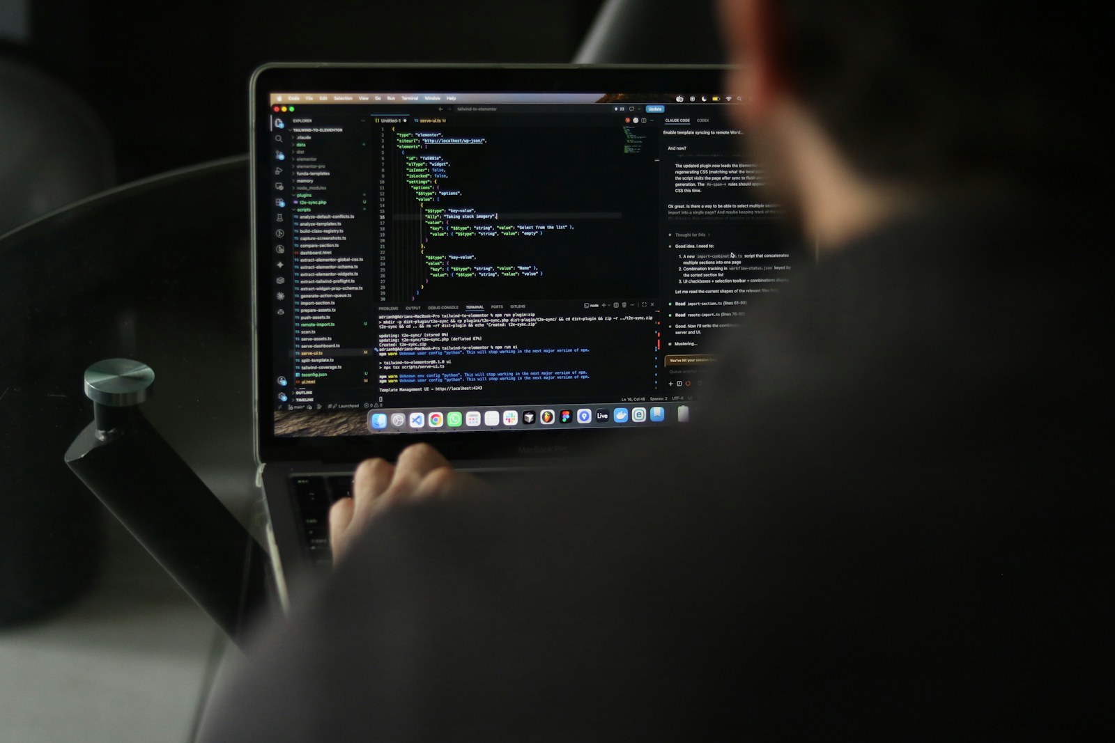 Software engineer working with code on a laptop